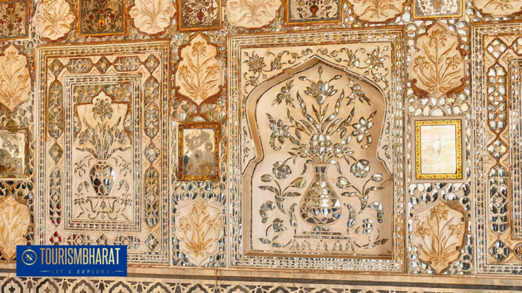 Sheesh Mahal mirrored hall inside Amber Fort with morning light on carved glass mosaic walls